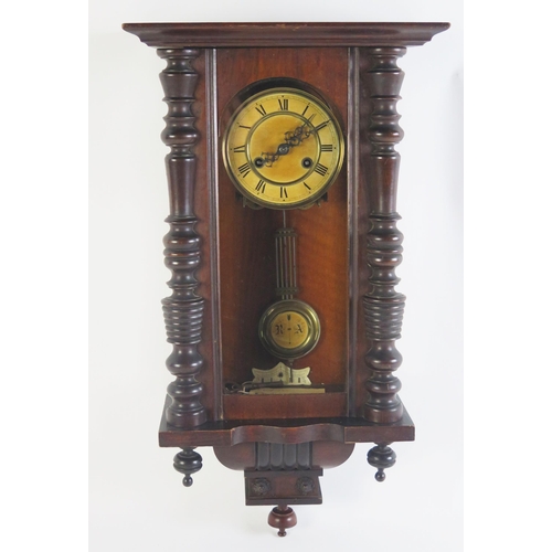 1196B - A late 19th century mahogany wall clock, with 14cm Roman dial, the movement with grid iron pendulum ... 