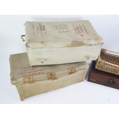 1343A - Two wicker and canvas bound military laundry baskets, wicker tray and a mahogany box.