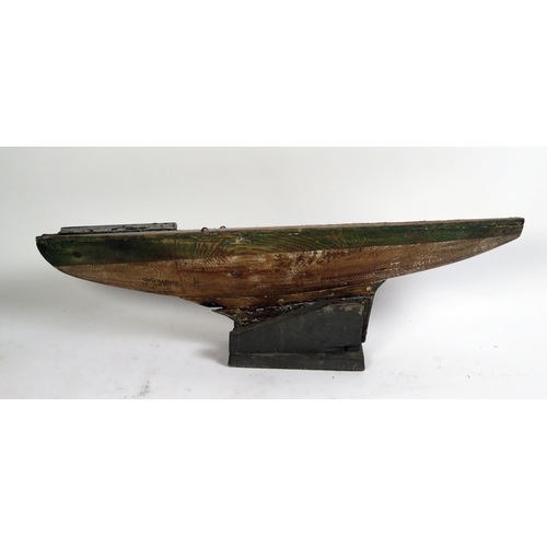 1690 - An Edwardian pine pond yacht hull, with lead keel, 77cm long.