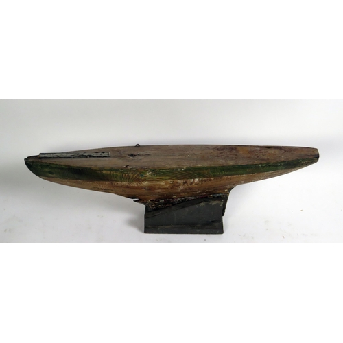 1690 - An Edwardian pine pond yacht hull, with lead keel, 77cm long.