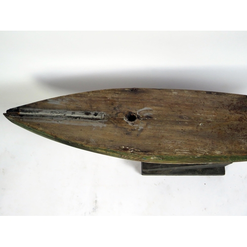 1690 - An Edwardian pine pond yacht hull, with lead keel, 77cm long.