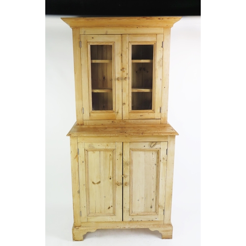 1701 - A Victorian stripped pine dresser, the upper part with a moulded cornice and a pair of glazed panel ... 