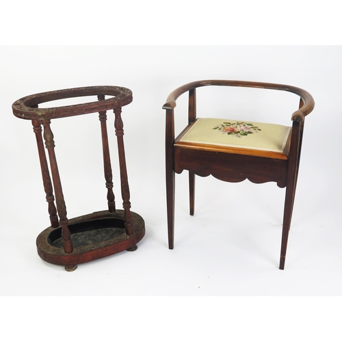 1702 - An Edwardian mahogany piano stool, with swept back rail, .hinged seat raised on four square tapering... 