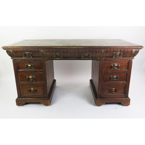 1711 - A late Victorian oak twin pedestal desk, the rectangular top with inset leather writing surface, wit... 