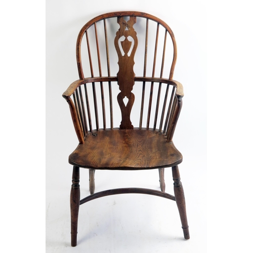 1713 - A late 18th century elm Windsor style elbow chair, the arch back with central shaped splat having sh... 