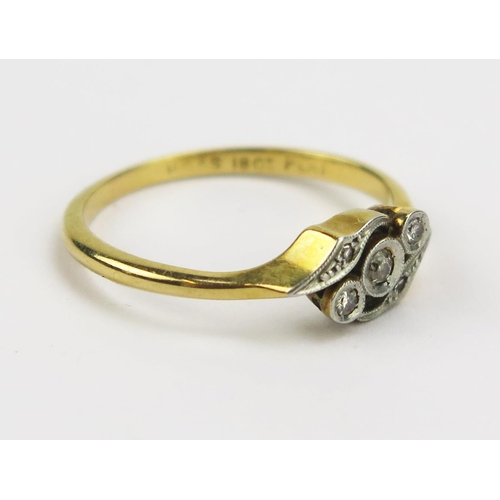 325 - An 18ct Gold and Old Cut Diamond Crossover Ring in a platinum setting, size M, stamped 18CT PLAT, 2.... 