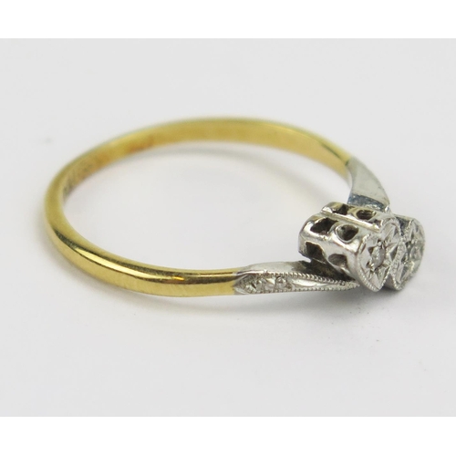 329 - An 18ct Gold and Diamond Heart Shaped Crossover Ring, size M, stamped 18CT PLAT, 2.3g