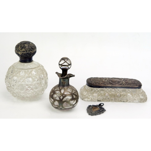 789 - Two clear glass and silver mounted scent bottles, together with a glass and silver mounted dressing ... 