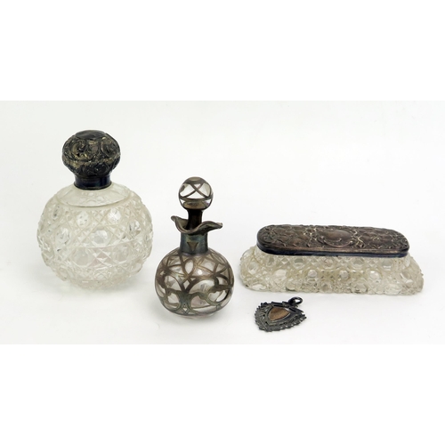 789 - Two clear glass and silver mounted scent bottles, together with a glass and silver mounted dressing ... 