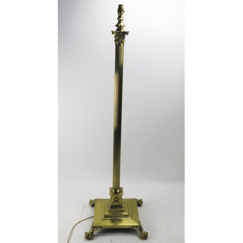 1115 - A 20th century brass Corinthian column telescopic standard lamp, with reeded column on a stepped squ... 