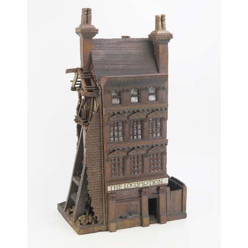 1164 - Ned Heywood of Chepstow, architectural stoneware sculpture of a partially war torn Victorian pub 'Th... 