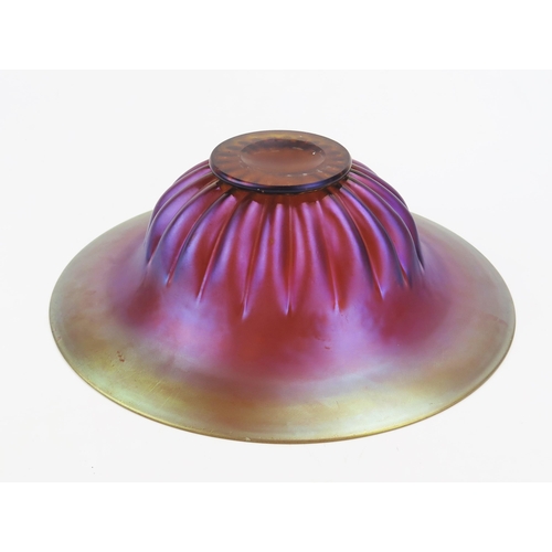 1638 - A WMF Myra series iridescent glass bowl, with flared rim and fluted body, on a circular foot, 32cm d... 