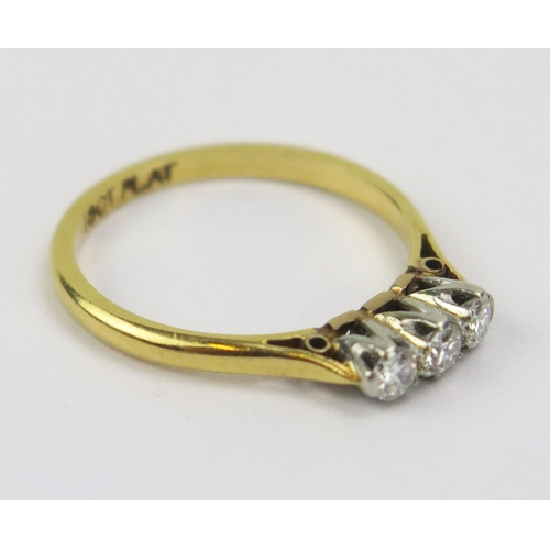 309 - An 18ct Gold and Diamond Three Stone Ring, c. 2.8mm platinum set stones, size K, 2.08g