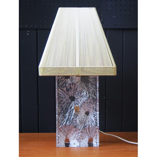 1068A - A Daum crystal glass table lamp of rectangular outline with cratered decoration, 32cm high, circa 19... 