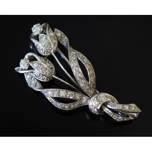13 - A Diamond Tulip Spray Brooch in a precious white metal setting, c. 3.54mm largest old cuts, 43.8mm, ... 