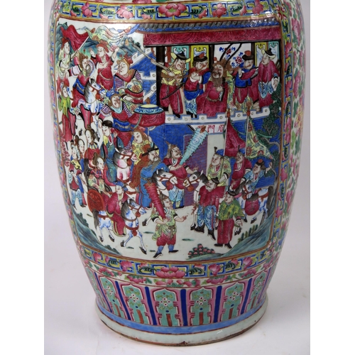 140 - A large 19th century Cantonese famille verte vase, of ovoid form, with flared rim, with handles in t... 