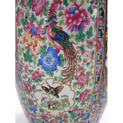 140 - A large 19th century Cantonese famille verte vase, of ovoid form, with flared rim, with handles in t... 