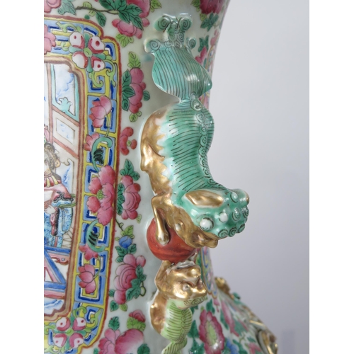 140 - A large 19th century Cantonese famille verte vase, of ovoid form, with flared rim, with handles in t... 