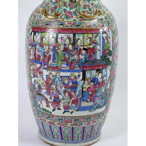 140 - A large 19th century Cantonese famille verte vase, of ovoid form, with flared rim, with handles in t... 