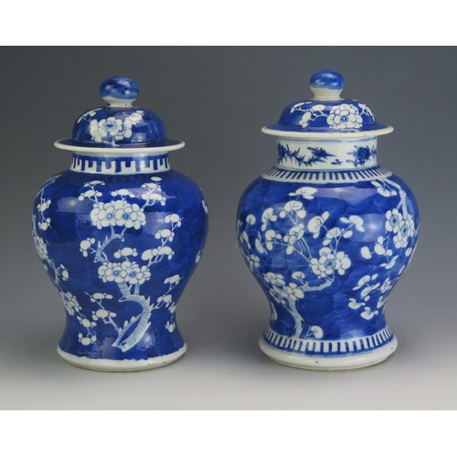 141 - A Chinese blue and white vase and cover, of ovoid form with all over prunus decoration, bears four c... 