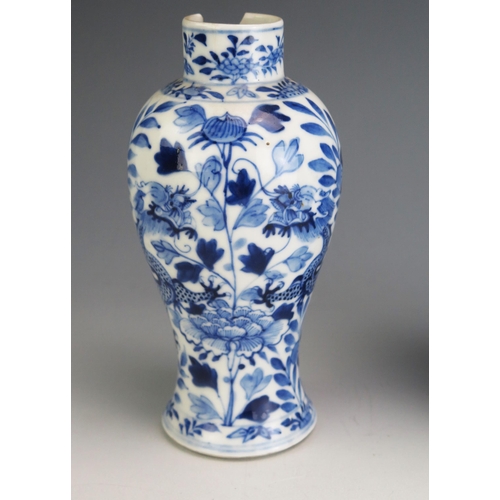 143 - A Chinese blue and white vase of ovoid form decorated with panels of floral sprays, with raised lotu... 