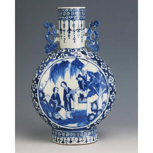 145 - An 18th Century Chinese blue and white moon flask, of traditional design, the central panels decorat... 