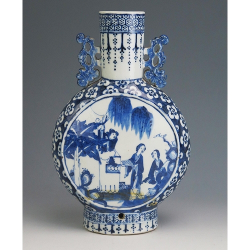 145 - An 18th Century Chinese blue and white moon flask, of traditional design, the central panels decorat... 