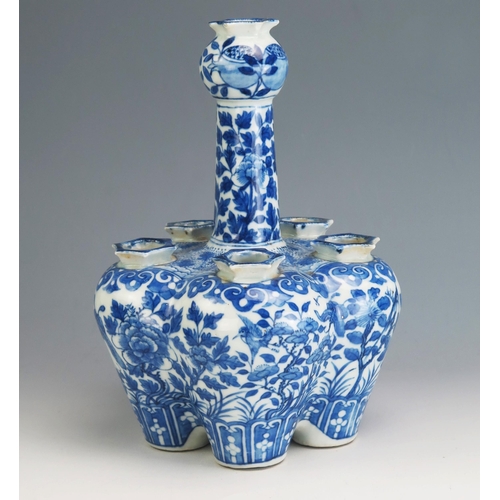 146 - A Chinese Qing porcelain blue and white tulip vase, of lobed form decorated with birds, butterflies ... 