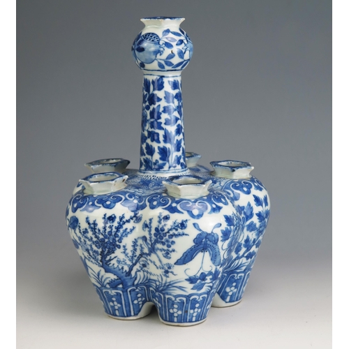 146 - A Chinese Qing porcelain blue and white tulip vase, of lobed form decorated with birds, butterflies ... 