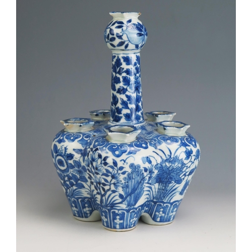 146 - A Chinese Qing porcelain blue and white tulip vase, of lobed form decorated with birds, butterflies ... 