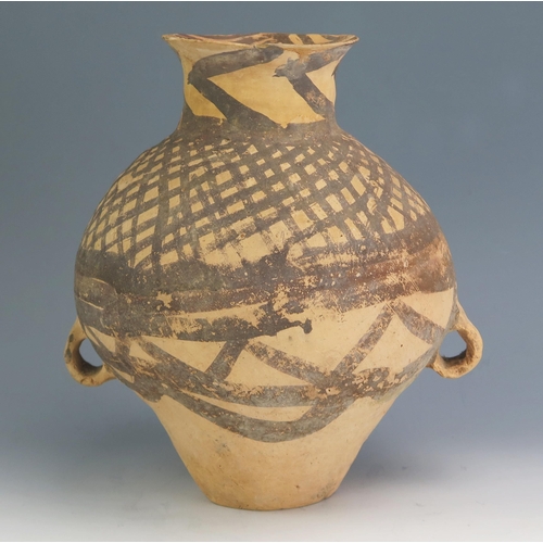 151 - A Chinese Neolithic terracotta jar, of ovoid form, with painted geometric decoration, with loop hand... 