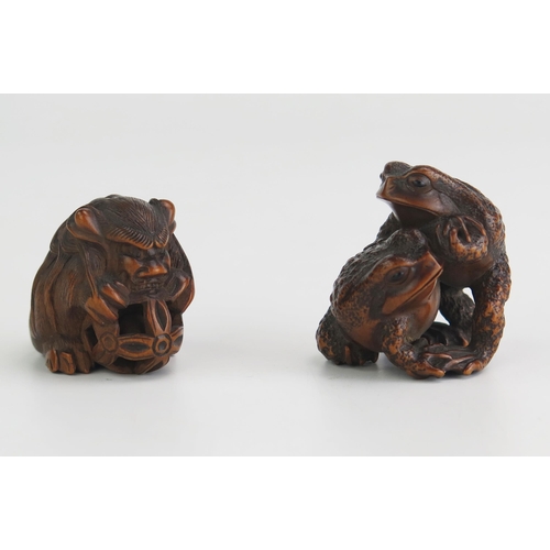 158 - A Japanese carved hardwood netsuke of two toads, signed, 3.5cm high, together with another boxwood n... 