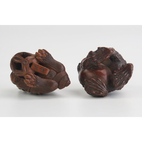 158 - A Japanese carved hardwood netsuke of two toads, signed, 3.5cm high, together with another boxwood n... 