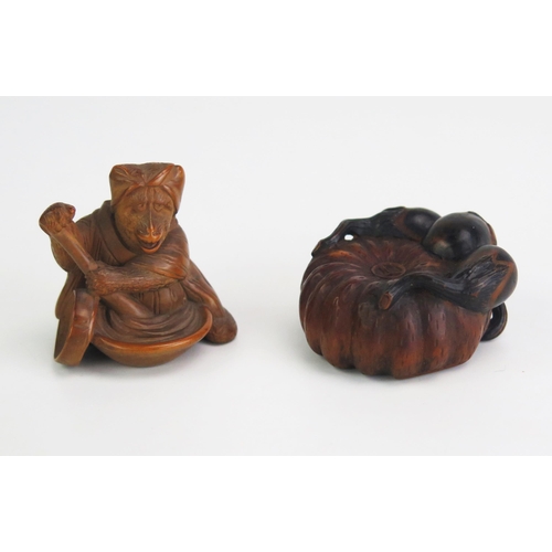 162 - A Japanese carved boxwood netsuke depicting a gourd, signed, 4cm diameter, and another netsuke of a ... 