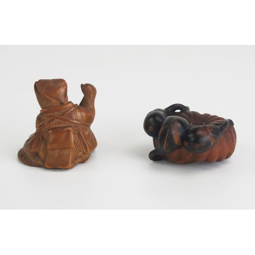 162 - A Japanese carved boxwood netsuke depicting a gourd, signed, 4cm diameter, and another netsuke of a ... 