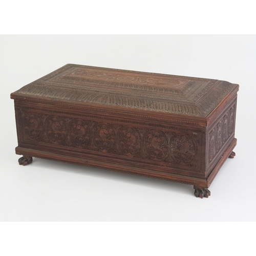 166 - A 19th Century Indian carved sandal wood table top casket, of rectangular outline, with lift off lid... 