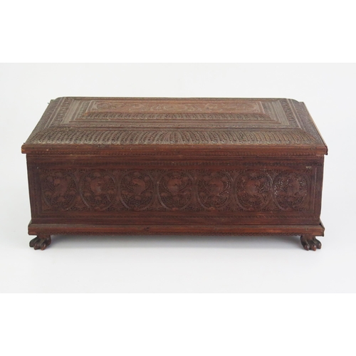 166 - A 19th Century Indian carved sandal wood table top casket, of rectangular outline, with lift off lid... 