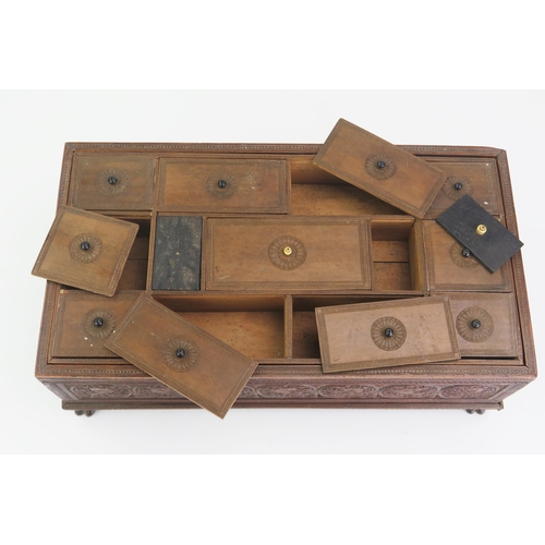 166 - A 19th Century Indian carved sandal wood table top casket, of rectangular outline, with lift off lid... 