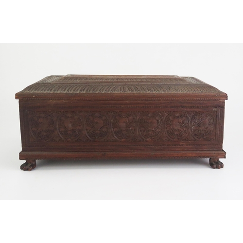 166 - A 19th Century Indian carved sandal wood table top casket, of rectangular outline, with lift off lid... 