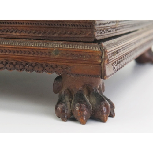 166 - A 19th Century Indian carved sandal wood table top casket, of rectangular outline, with lift off lid... 