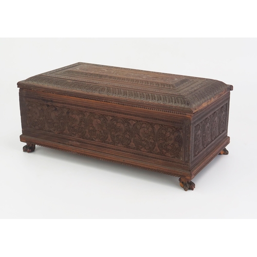 166 - A 19th Century Indian carved sandal wood table top casket, of rectangular outline, with lift off lid... 