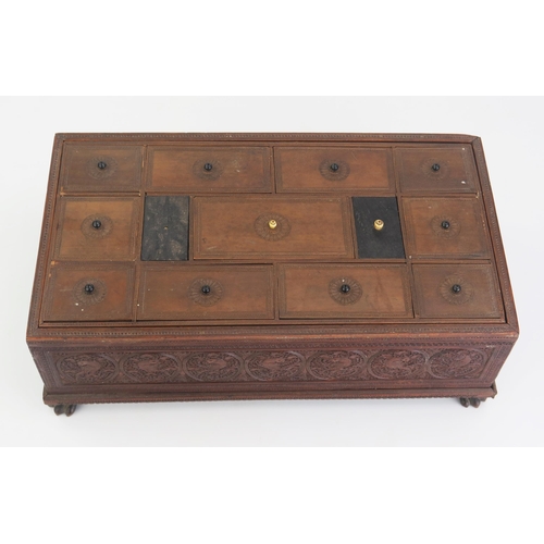 166 - A 19th Century Indian carved sandal wood table top casket, of rectangular outline, with lift off lid... 