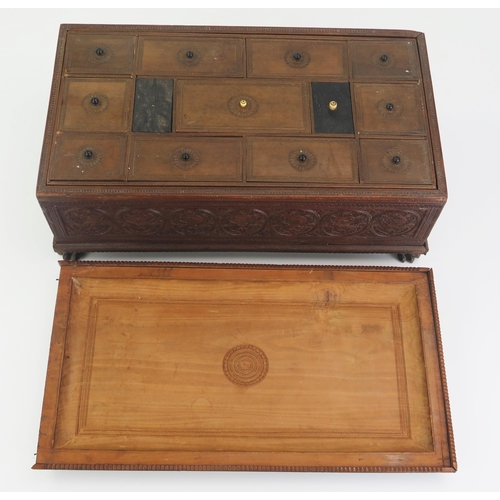 166 - A 19th Century Indian carved sandal wood table top casket, of rectangular outline, with lift off lid... 