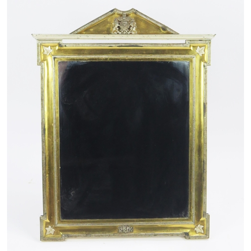 170 - A Royal Presentation gilt metal and metal mounted easel back mirror of arched outline, the pediment ... 