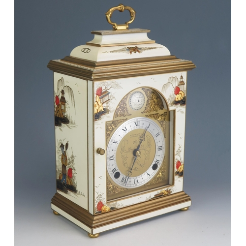 171 - A 20th century bracket clock by Elliot, decorated in the Chinoiserie taste, with domed caddy top wit... 