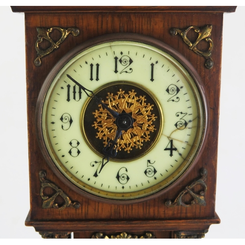 172 - An oak and brass mounted miniature longcase timepiece, of arched outline, with four reeded Corinthia... 