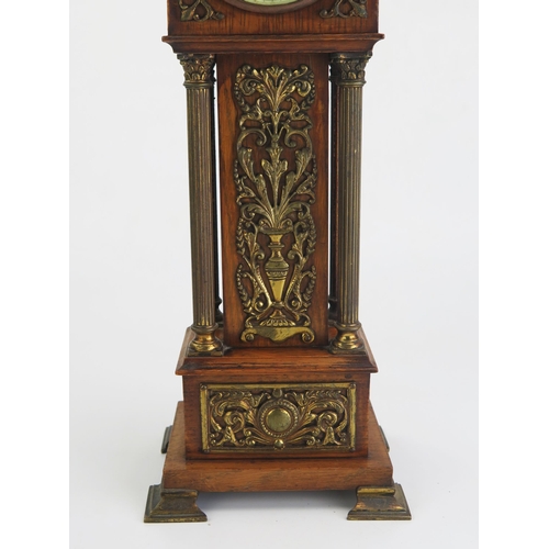 172 - An oak and brass mounted miniature longcase timepiece, of arched outline, with four reeded Corinthia... 