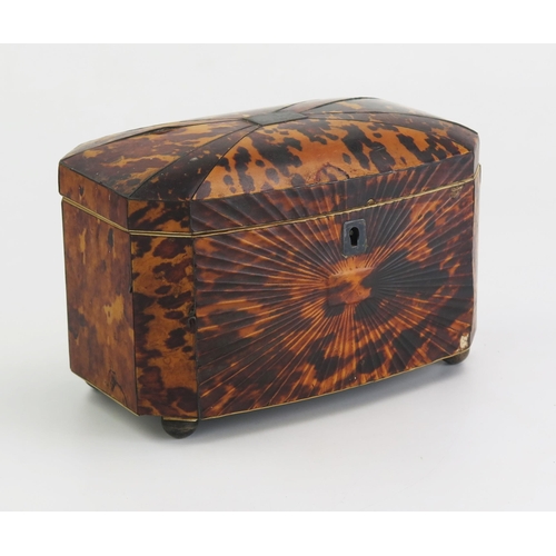 175 - A 19th century blonde tortoiseshell tea caddy of rectangular outline, with shallow domed hinged lid,... 