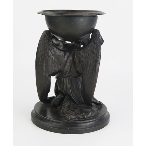 178 - A 19th century bronze study of a bearded, kneeling angel supporting a bowl, raised on a circular bas... 