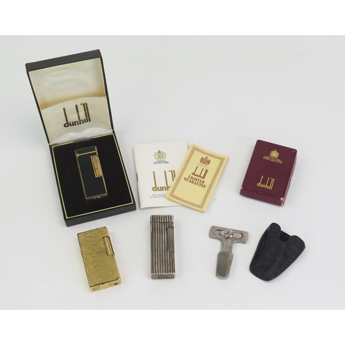 188 - A Dunhill gilt metal and black lacquer Rollagas lighter, cased with instructions and guarantee, a Du... 